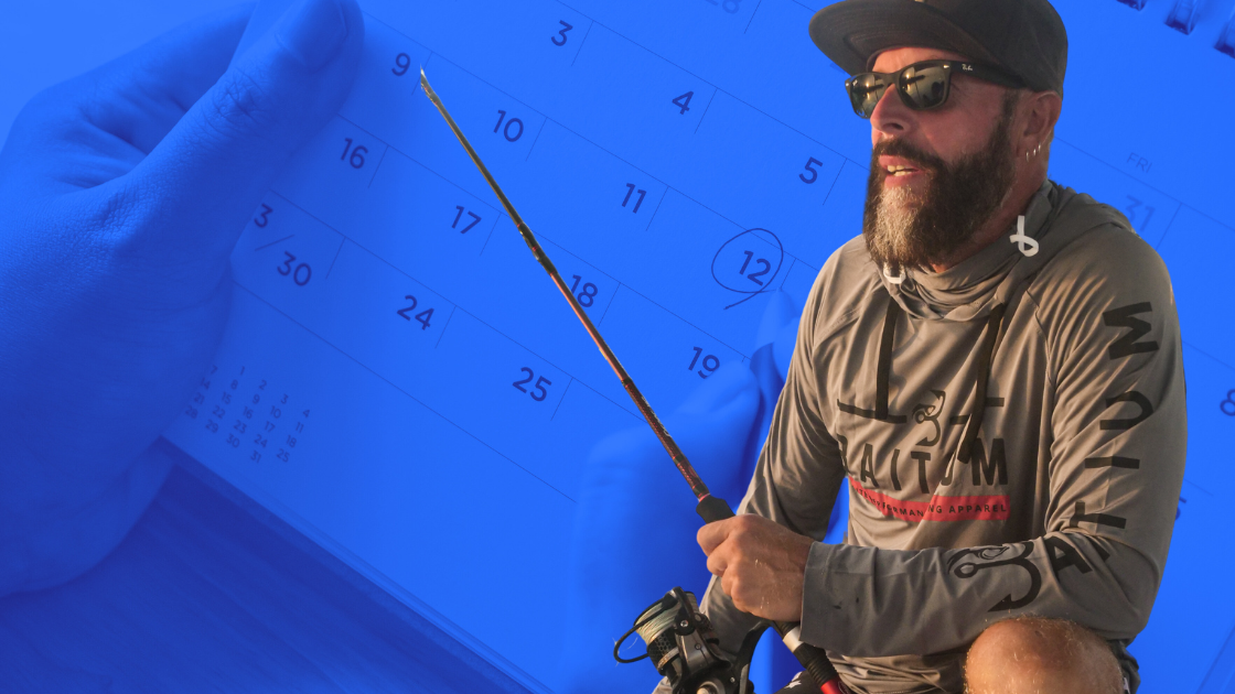 man with fishing rod and calendar - is today a good day to go fishing?